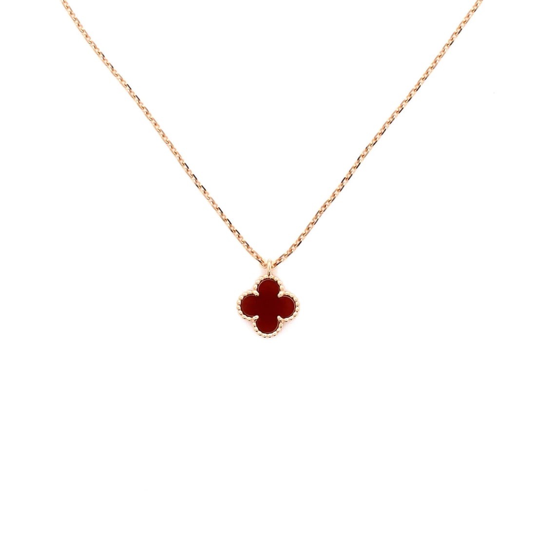 Van Cleef & Arpels Sweet Alhambra Pendant Necklace in 18K Rose Gold with Carnelian: Van Cleef & Arpels Sweet Alhambra Pendant Necklace in 18K Rose Gold with Carnelian Elevate your elegance with the Van Cleef & Arpels Sweet Alhambra Pendant Necklace, set in exquisite 18K rose gold and