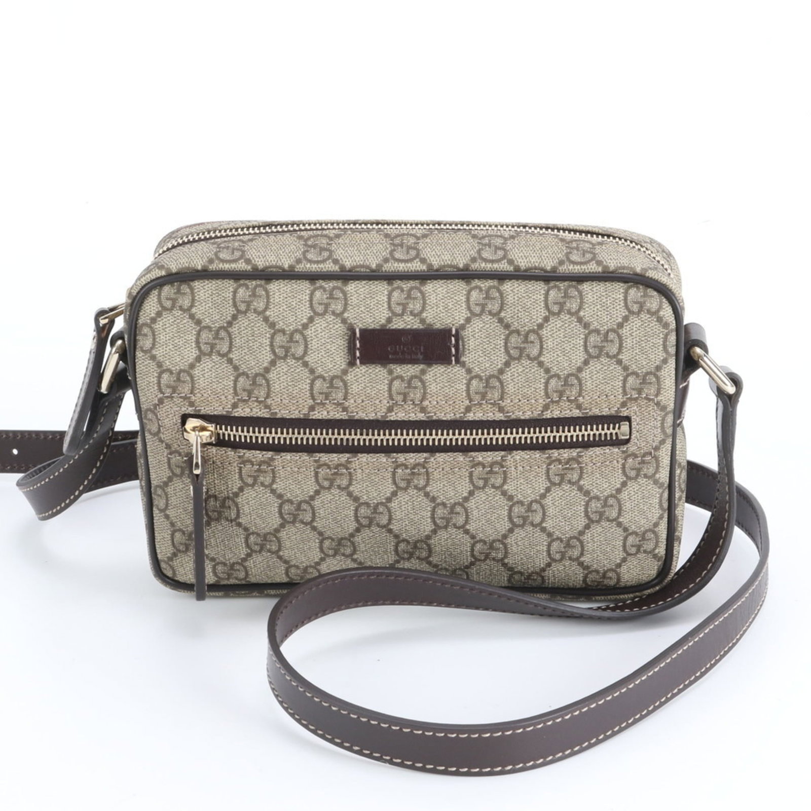 Gucci Shoulder Bag in Leather and Coated Canvas: Gucci Shoulder Bag in Leather and Coated Canvas Experience the timeless elegance of Gucci with this stunning shoulder bag, crafted from rich leather and coated canvas for a sophisticated look. The spa