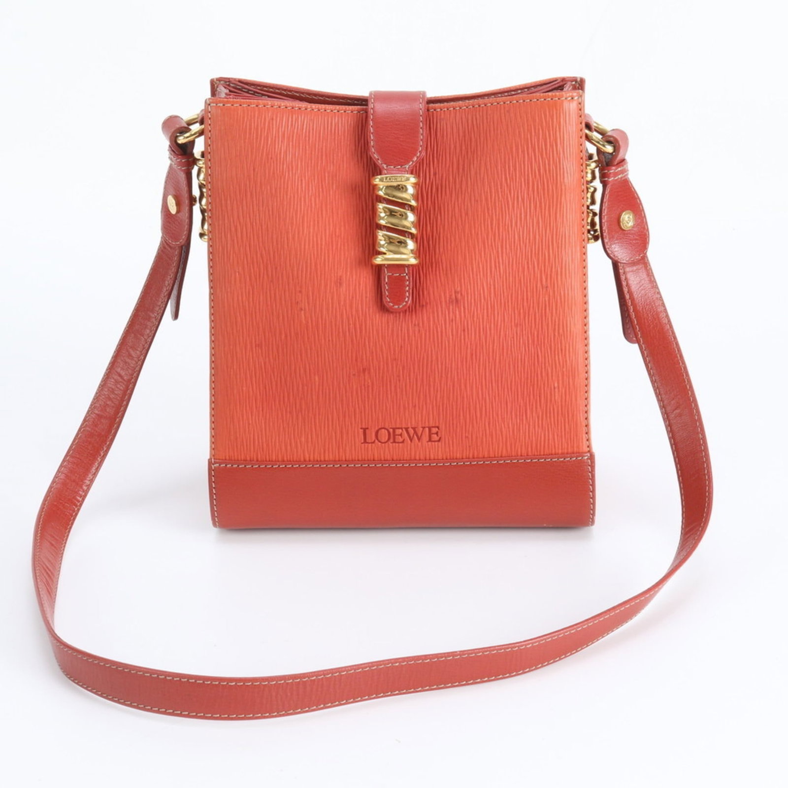 Loewe Leather Shoulder Bag: Loewe Leather Shoulder Bag A stunning Loewe leather shoulder bag in rich red hue, boasting classic design and premium quality craftsmanship. With its spacious interior and adjustable strap, this versa