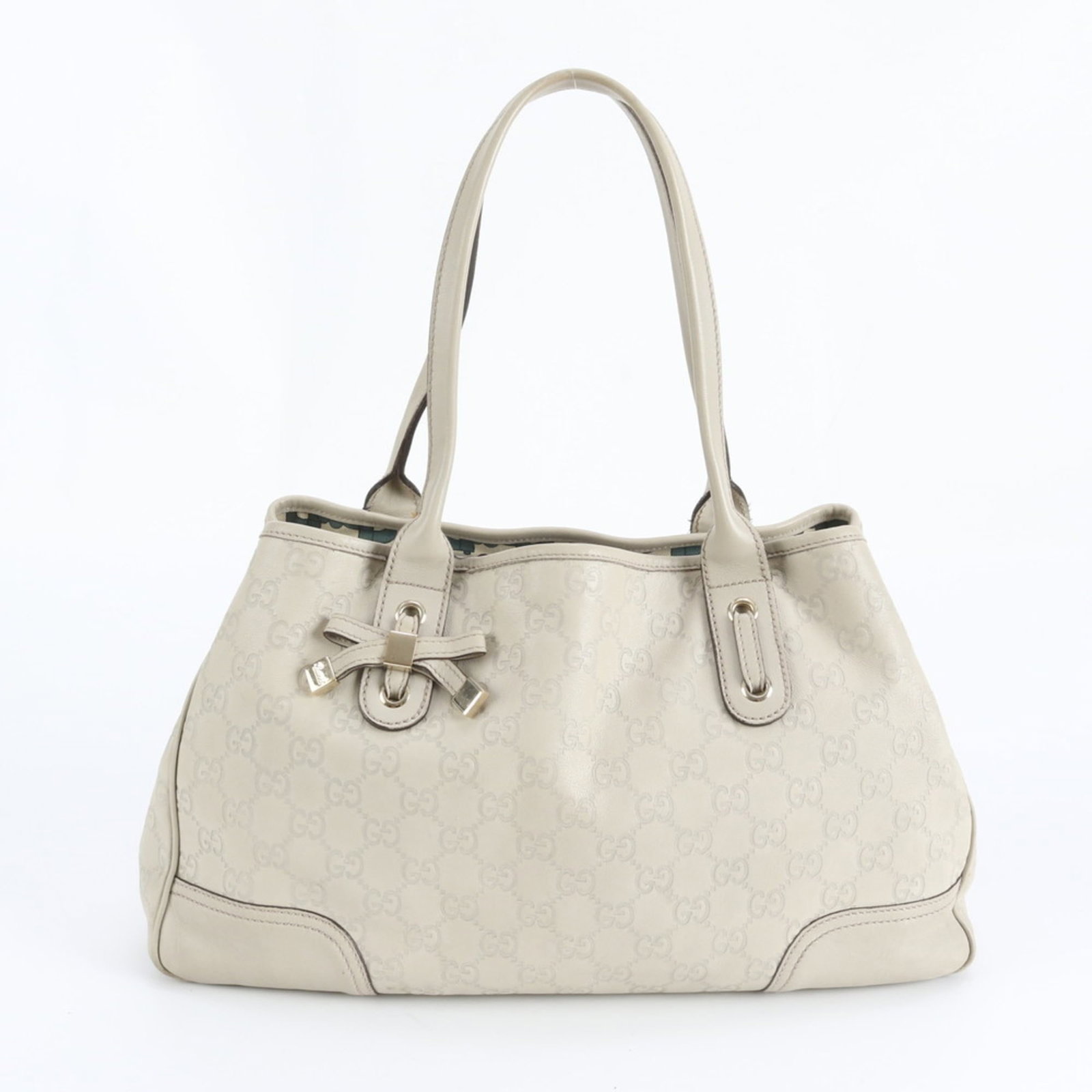 Gucci Tote Bag in Leather: Gucci Tote Bag in Leather Elevate your everyday style with this stunning Gucci leather tote bag, boasting classic Italian design and premium quality. Its timeless ivory color and spacious 37cm interio