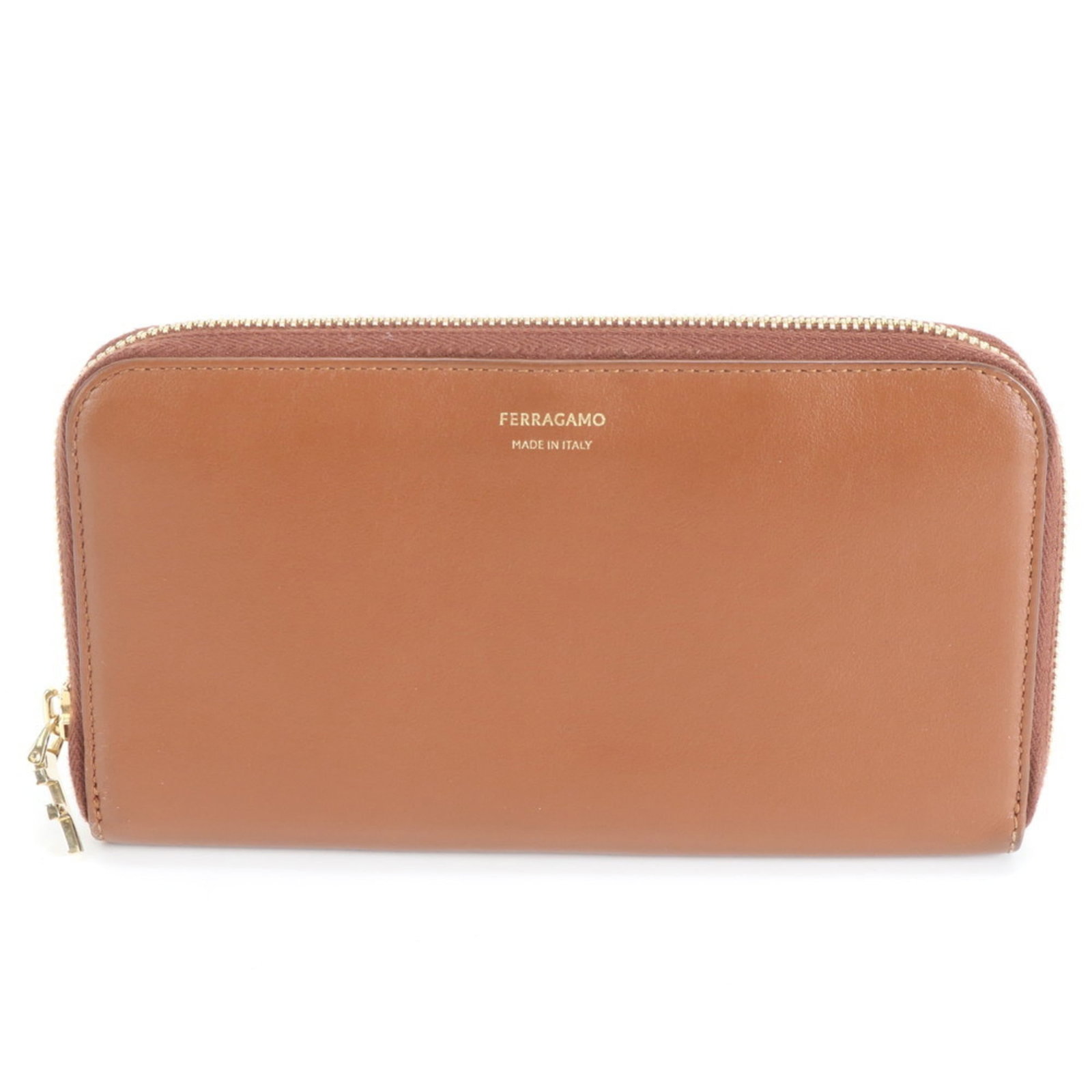 Salvatore Ferragamo Bi-Fold Leather Wallet: Salvatore Ferragamo Bi-Fold Leather Wallet A stylish and timeless accessory for the modern gentleman, this Salvatore Ferragamo bi-fold leather wallet boasts sleek brown leather and classic design. Wit