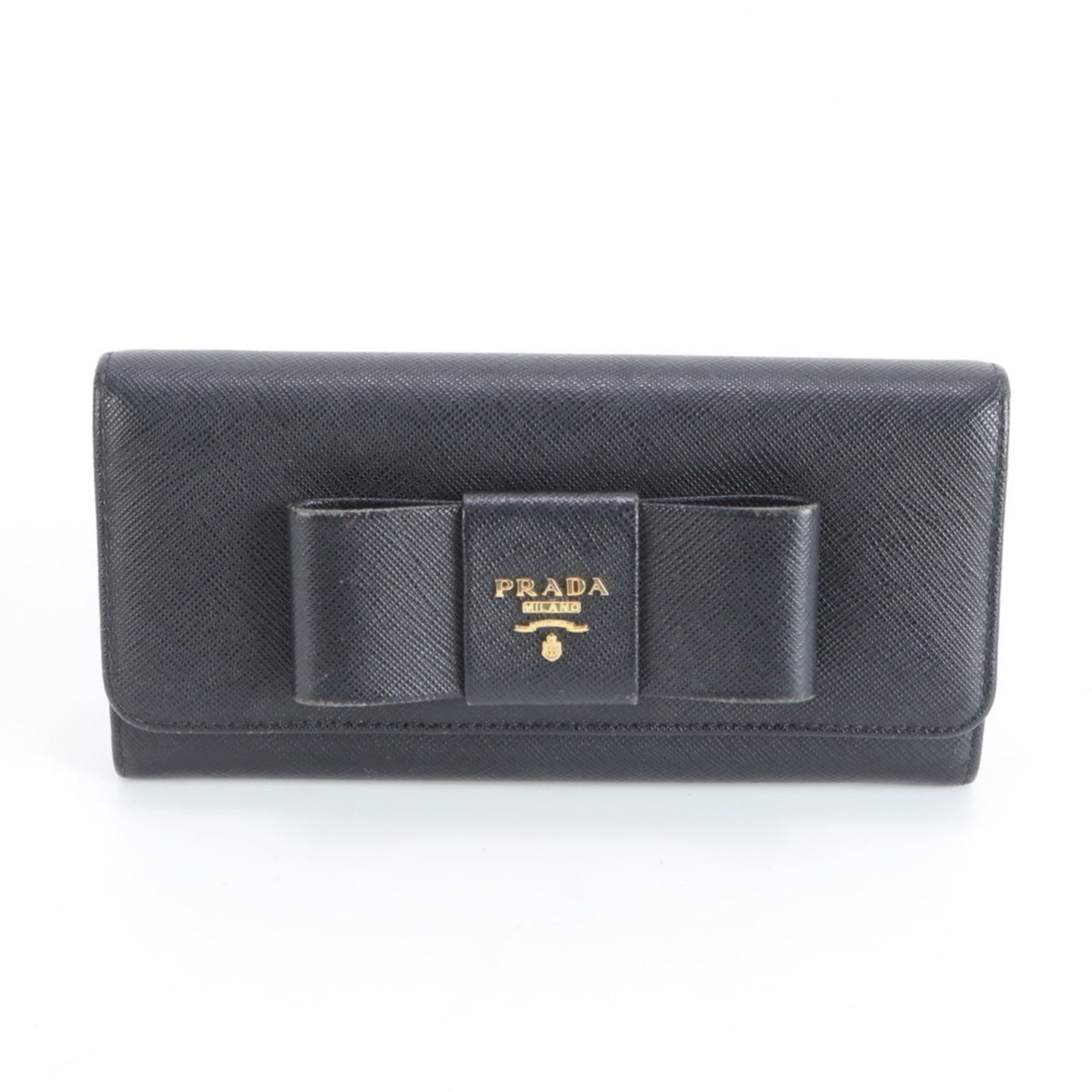 Prada Bi-Fold Leather Wallet: Prada Bi-Fold Leather Wallet A timeless and sophisticated accessory for the modern woman, this Prada bi-fold leather wallet boasts sleek black leather with subtle scratches and scuffs that add to its