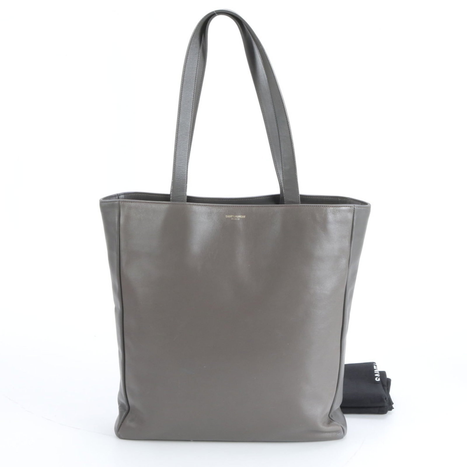 Yves Saint Laurent Tote Bag in Leather: Yves Saint Laurent Tote Bag in Leather A timeless and sophisticated Yves Saint Laurent tote bag, crafted from rich gray leather that exudes elegance and refinement. With its classic design and spaciou