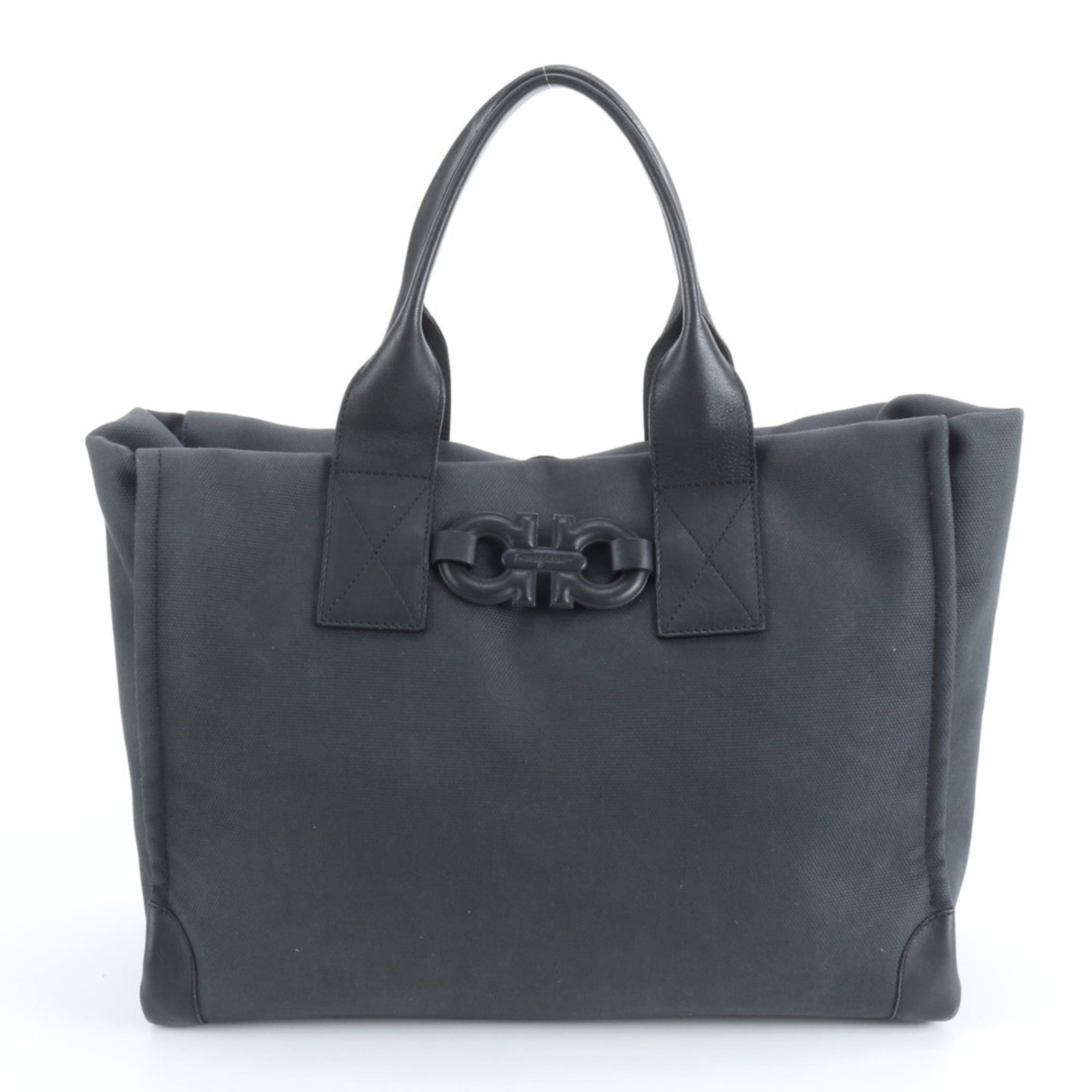 Salvatore Ferragamo Tote Bag in Leather and Canvas: Salvatore Ferragamo Tote Bag in Leather and Canvas Elevate your everyday style with the timeless Salvatore Ferragamo tote bag, crafted from luxurious leather and canvas in sleek black. This versatile