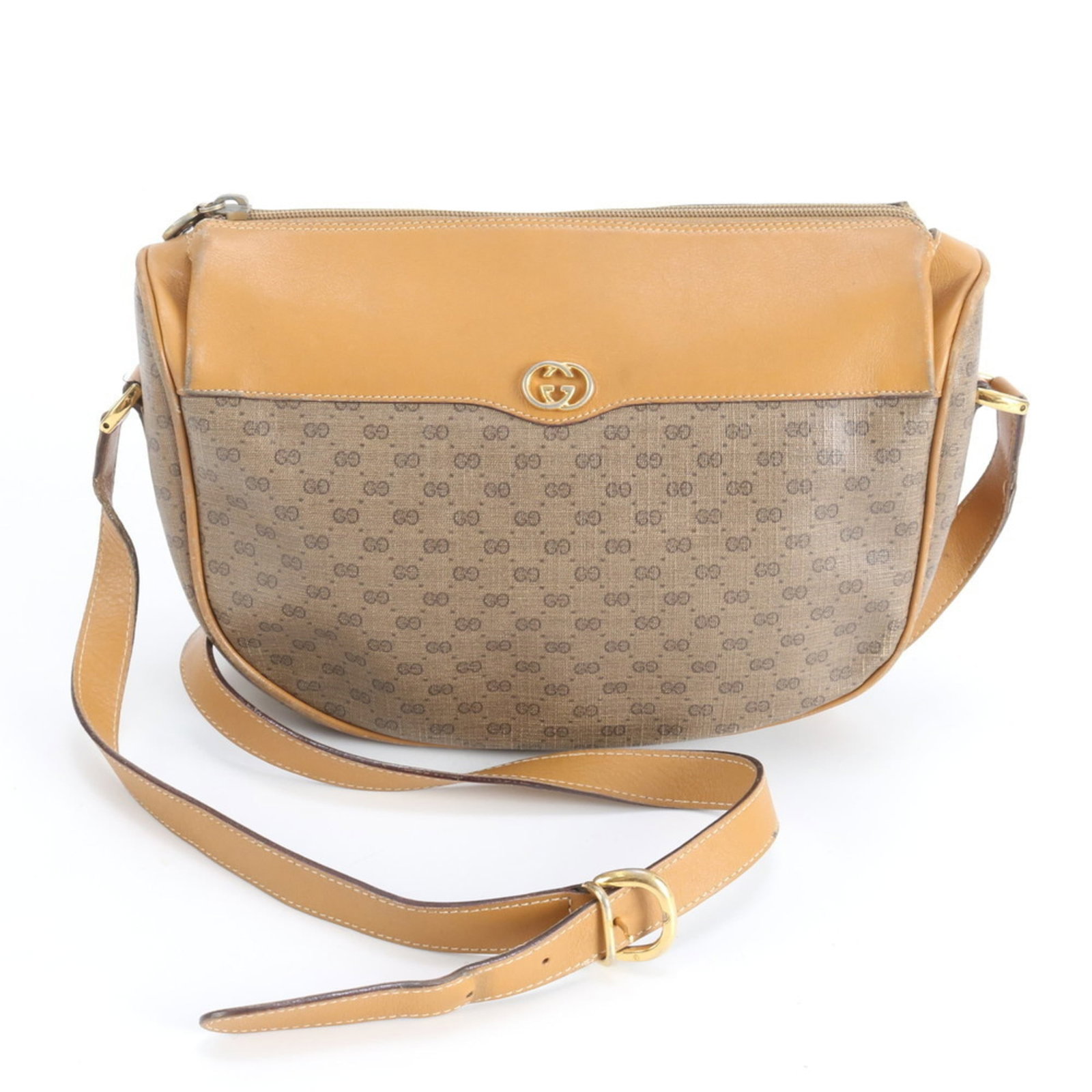 Gucci Shoulder Bag - Leather and Coated Canvas: Gucci Shoulder Bag - Leather and Coated Canvas A timeless Gucci shoulder bag in rich brown leather, paired with coated canvas accents, adds a touch of sophisticated elegance to any outfit. With its