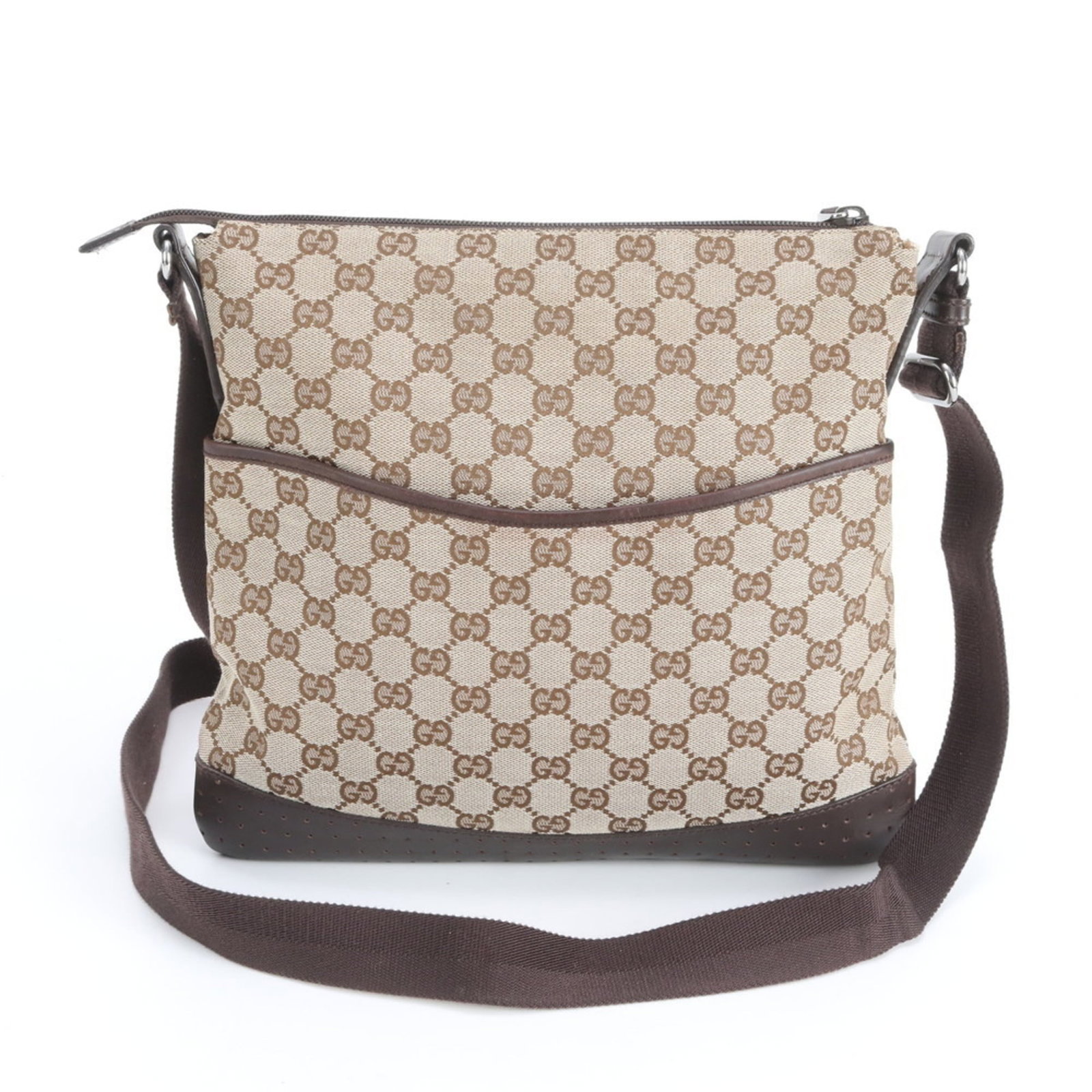 Gucci Canvas and Leather Shoulder Bag: Gucci Canvas and Leather Shoulder Bag A stylish and versatile Gucci shoulder bag, crafted from high-quality canvas and leather, boasts a timeless brown color that adds warmth to any outfit. With its s