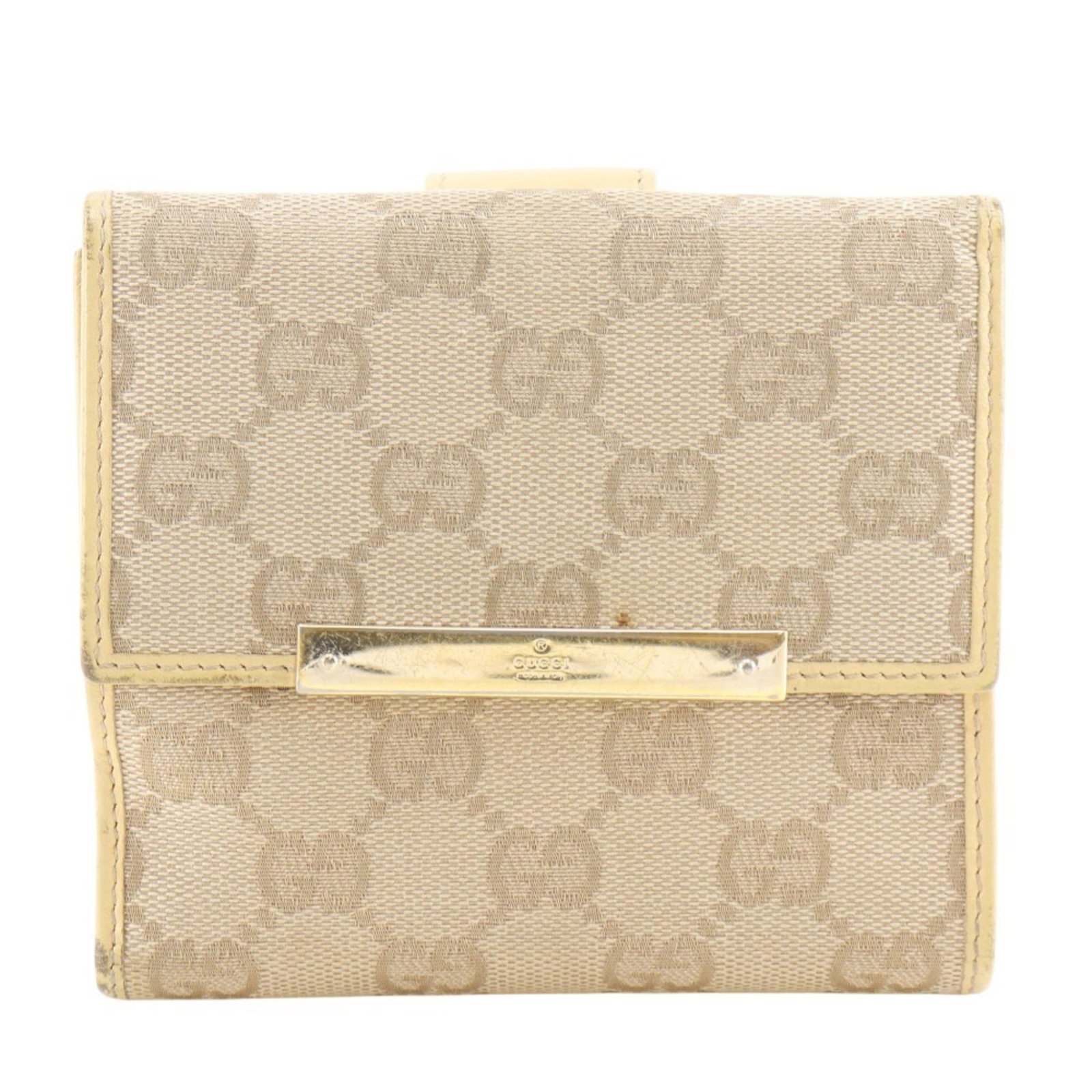 Canvas Gucci Wallet (Bi-Fold) Gg: Canvas Gucci Wallet (Bi-Fold) Gg A pre-owned Gucci bi-fold wallet in beige canvas, boasting the iconic luxury brand's signature style. With its classic design and sturdy construction, this wallet is