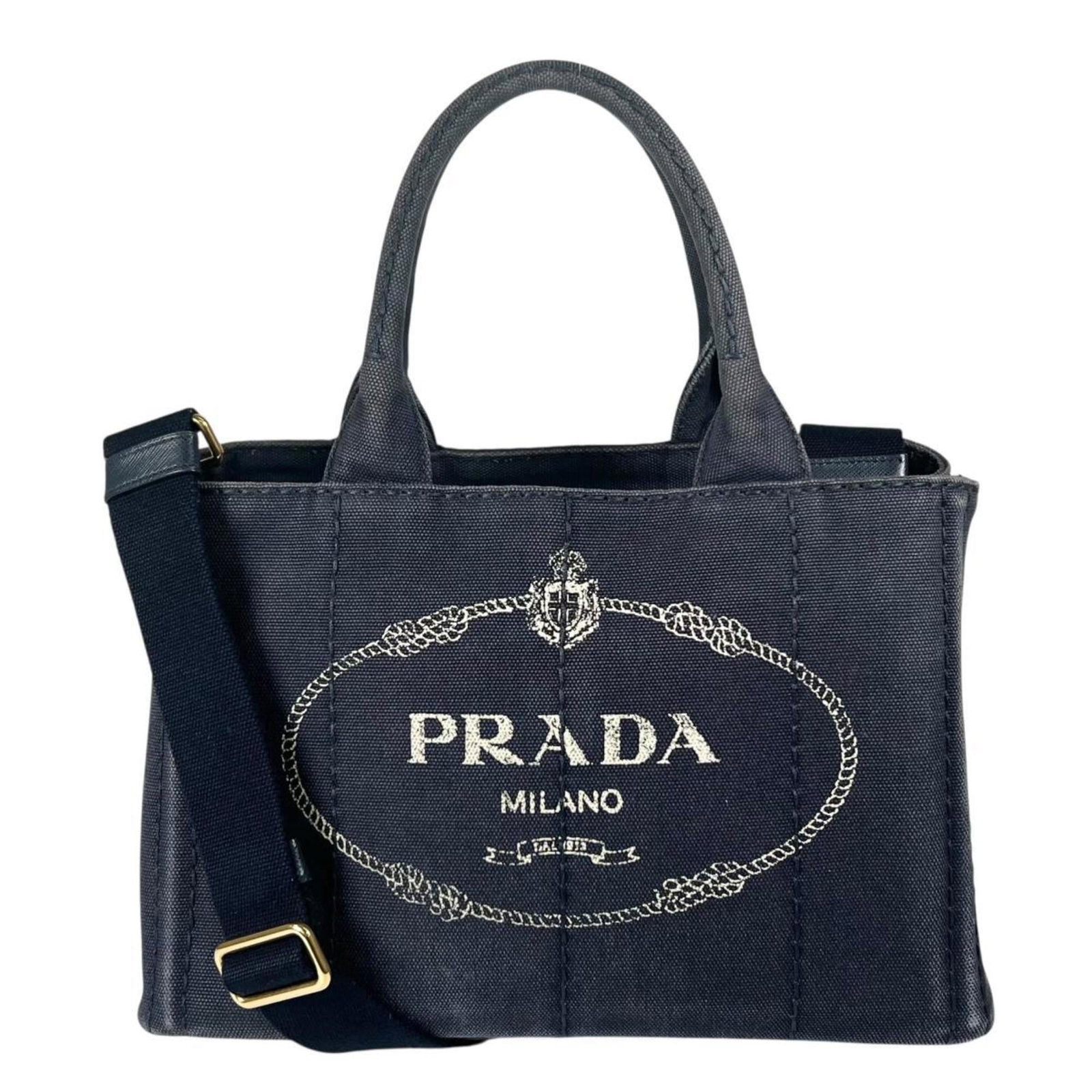 Prada Denim Tote Bag: Prada Denim Tote Bag A stylish and versatile Prada denim tote bag, perfect for adding a touch of luxury to your daily routine, boasts a rugged yet refined design in a beautiful blue hue. With its