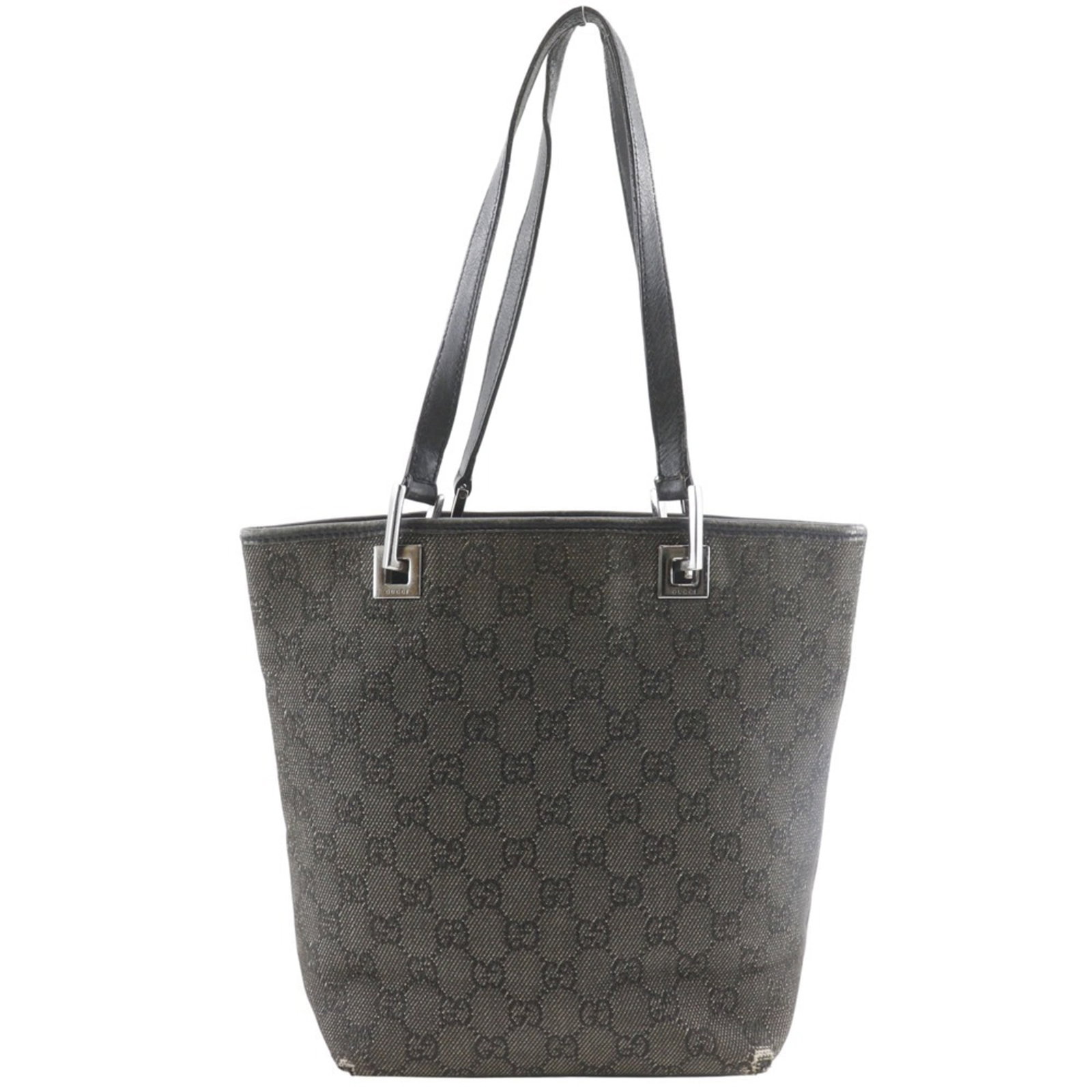 Gucci Denim Tote Handbag: Gucci Denim Tote Handbag A timeless Gucci denim tote, this classic handbag boasts the iconic Italian brand's signature style with its rugged yet refined denim construction and sleek black finish. With