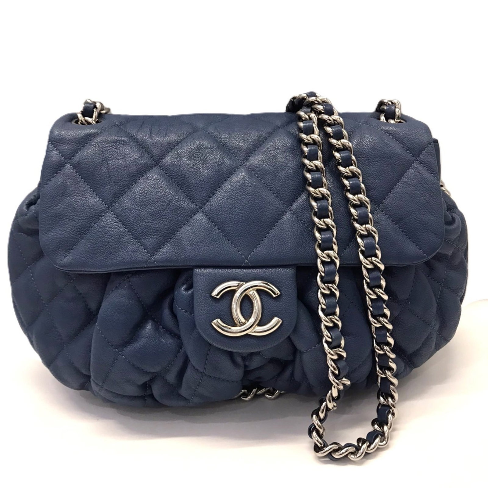 Chanel Shoulder Bag in Leather: Chanel Shoulder Bag in Leather A timeless Chanel shoulder bag in rich navy leather, complete with a classic flap closure and spacious inner pocket, makes for the perfect accessory to elevate any outfi