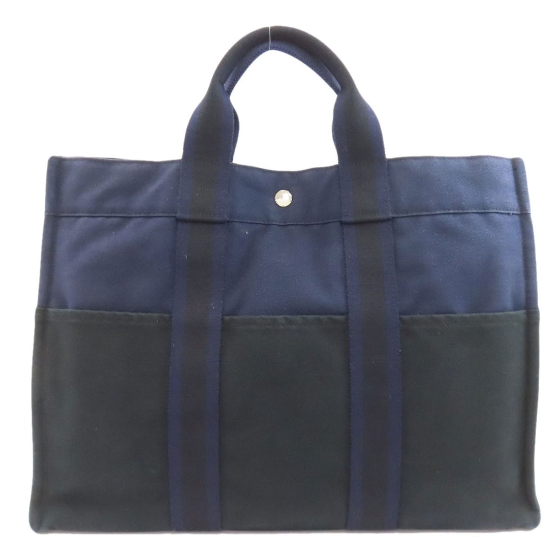 Canvas HERMES suck fool toeMM Handbag: Canvas HERMES suck fool toeMM Handbag Experience the timeless elegance of a classic HERMES canvas handbag, crafted in France with navy and black hues that exude sophistication. The iconic suck fool to