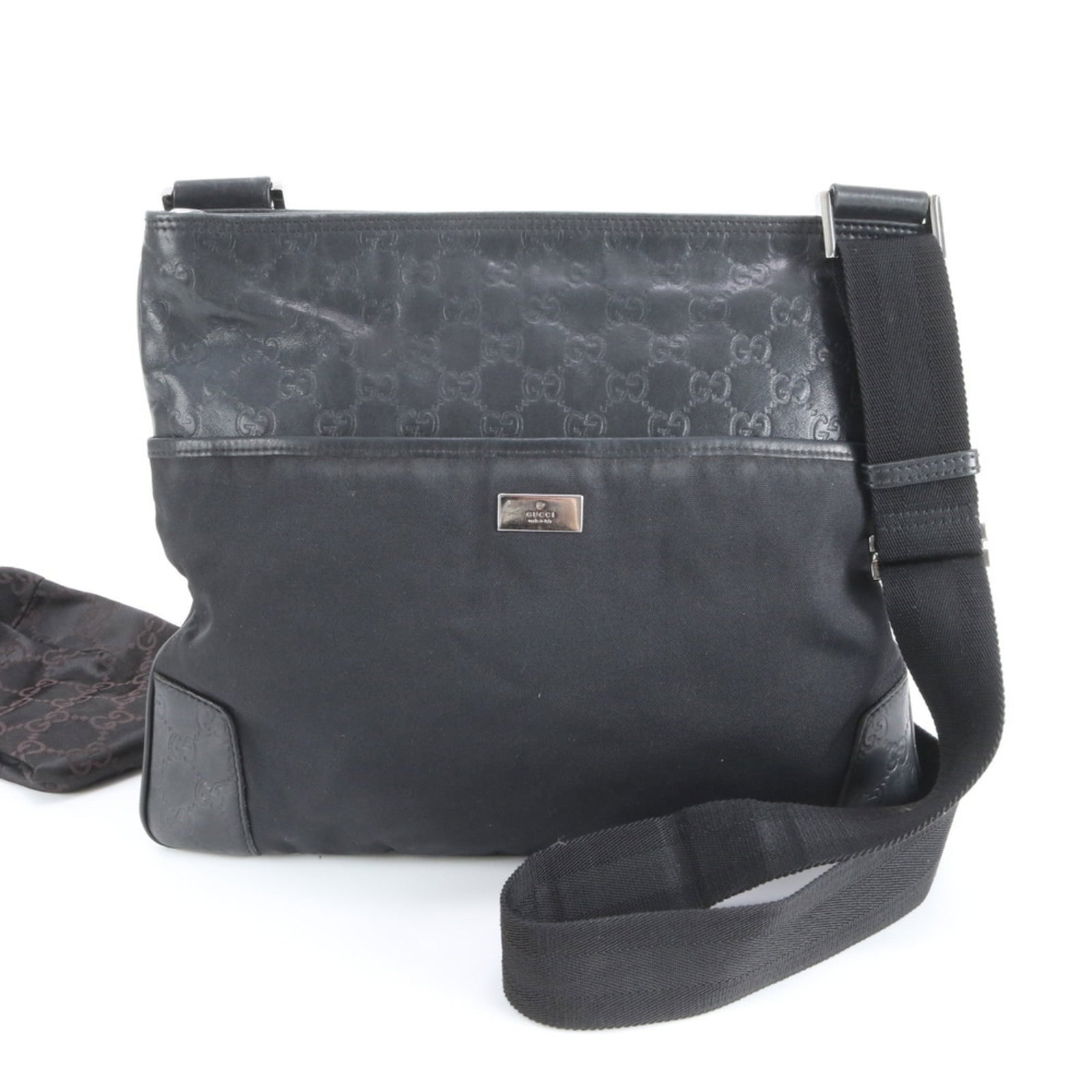 Gucci Nylon and Leather Shoulder Bag: Gucci Nylon and Leather Shoulder Bag A sleek and versatile Gucci shoulder bag, crafted from durable nylon and supple leather, boasts a timeless black hue that's perfect for adding an air of sophistica