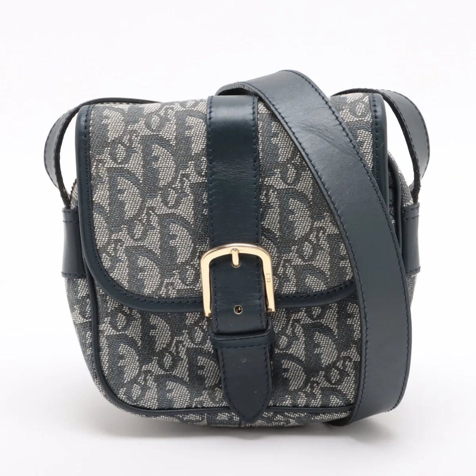 Trotter Christian Dior Shoulder Bag: Trotter Christian Dior Shoulder Bag A pre-owned Christian Dior Trotter shoulder bag in navy, boasting sleek lines and timeless design, perfect for adding an air of sophistication to any outfit. With i