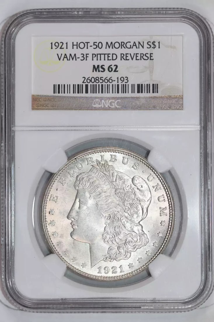 1921 MORGAN VAM-3F PITTED REVERSE HOT 50 DOLLAR NGC MS62: 1921 MORGAN VAM-3F PITTED REVERSE HOT 50 DOLLAR NGC MS62 Experience the rare beauty of the 1921 Morgan Dollar, graded MS62 by the Numismatic Guaranty Corporation (NGC). This stunning example boasts a