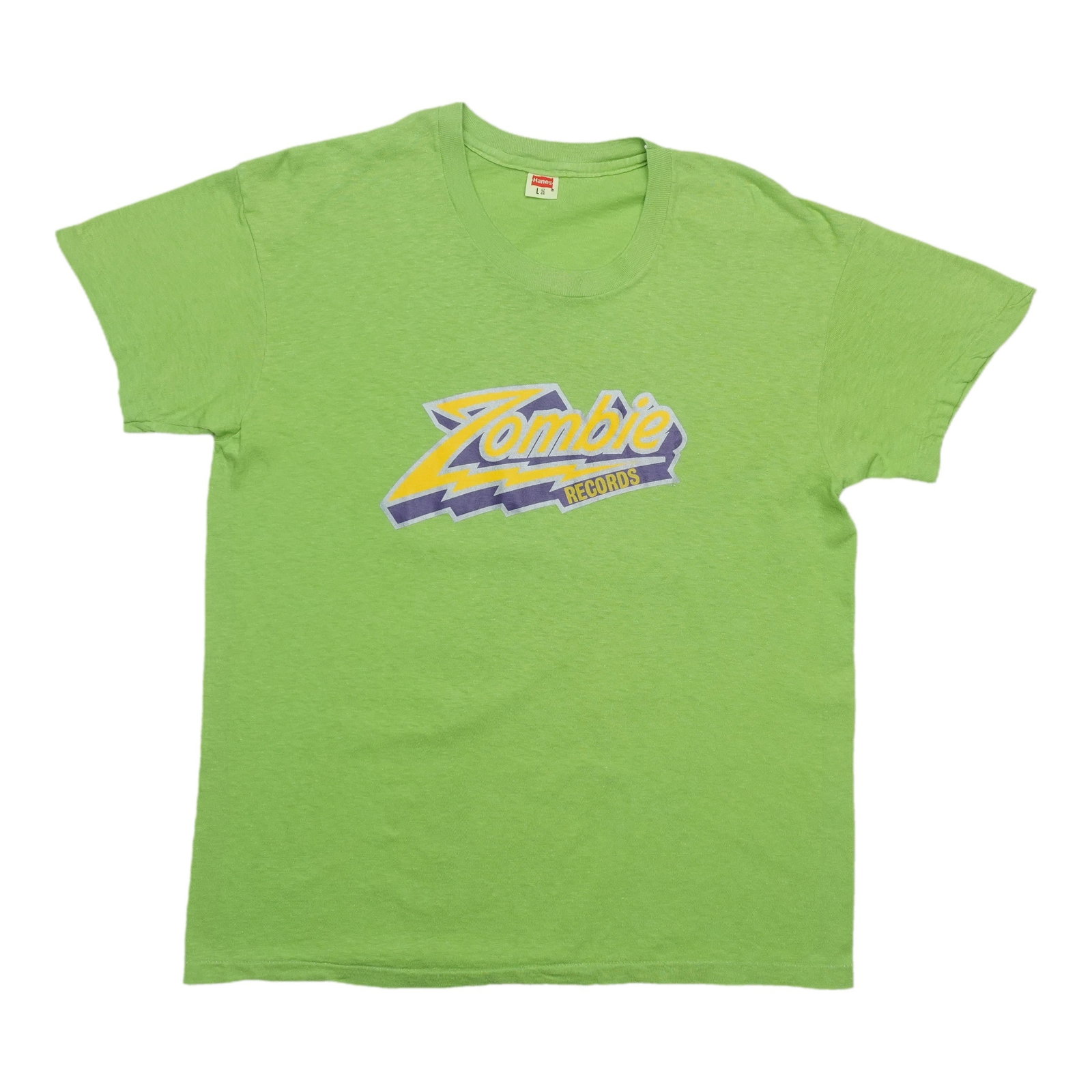 Shirt 1970s Zombie Records: Shirt 1970s Zombie Records Get ready to rock the decade of excess with this authentic 1970s Zombie Records shirt, boasting a vibrant green hue and classic fit that's still on point today. Made from 10