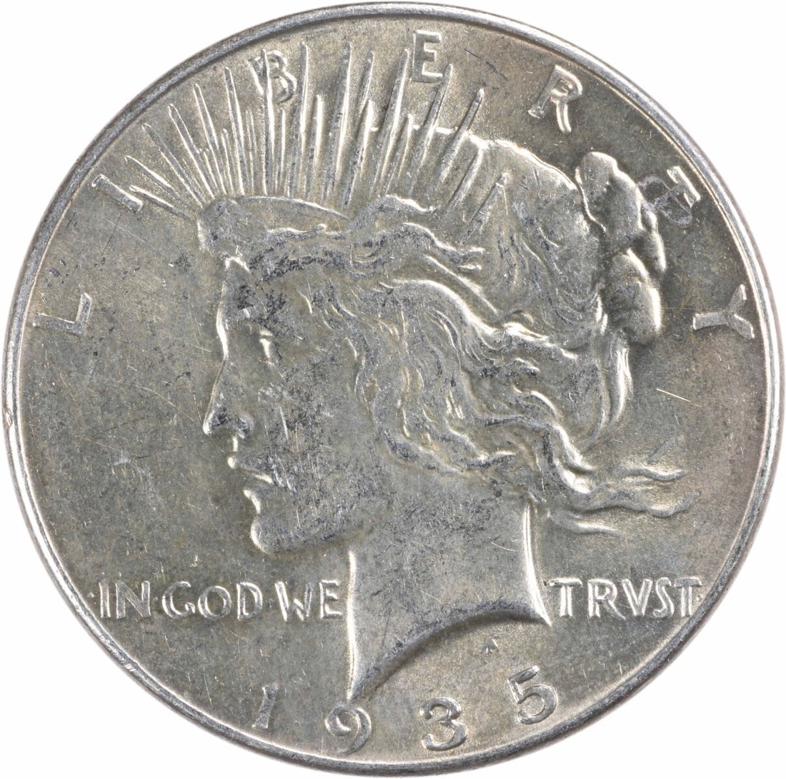 1935 Peace Silver Dollar - AU Slider - Uncertified: 1935 Peace Silver Dollar - AU Slider - Uncertified A rare and historic 1935 Peace Silver Dollar, certified as circulated with an AU grade, boasts its original silver content and Philadelphia mint mark