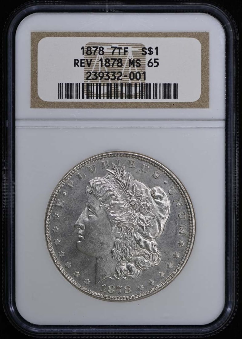 1878 7TF Rev of '78 Morgan Dollar, NGC MS65: 1878 7TF Rev of '78 Morgan Dollar, NGC MS65 Experience the majesty of the 1878 Morgan Dollar, certified by NGC as MS65, one of the finest examples of this iconic coin in uncirculated condition. With i