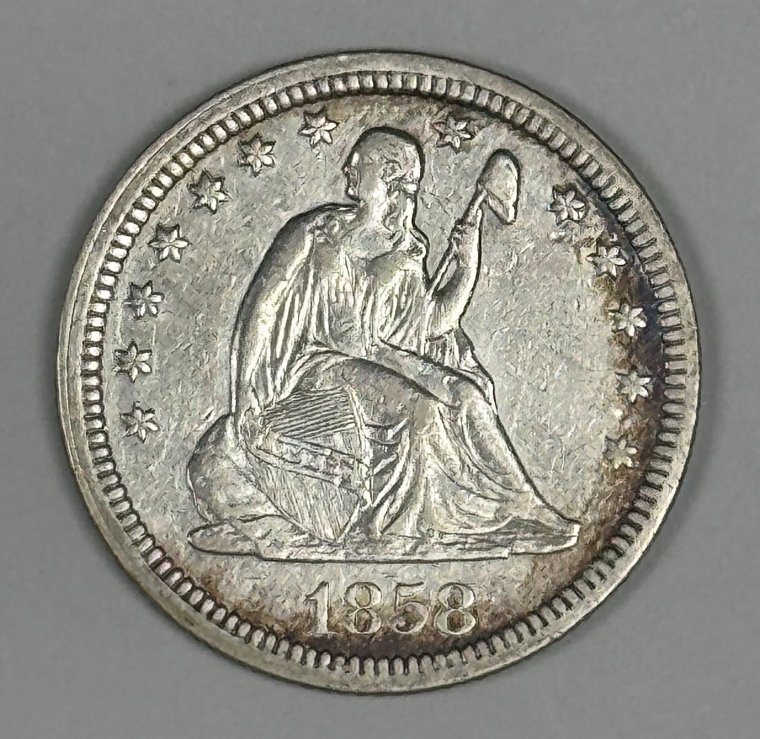 Seated Liberty Quarter 1858 Choice: Seated Liberty Quarter 1858 Choice Experience the elegance of the Seated Liberty Quarter, minted in 1858 and featuring one of America's most iconic coin designs. This circulated example boasts a high