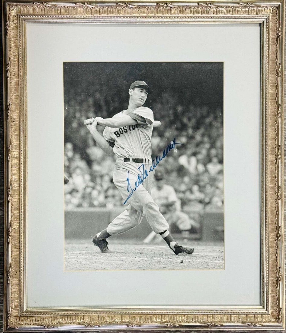 (JSA) Ted Williams Autographed 10x13 Framed Baseball Photo: (JSA) Ted Williams Autographed 10x13 Framed Baseball Photo Experience the iconic swing of baseball legend Ted Williams, autographed in blue sharpie across a stunning 10x13 matted and framed photo. Thi