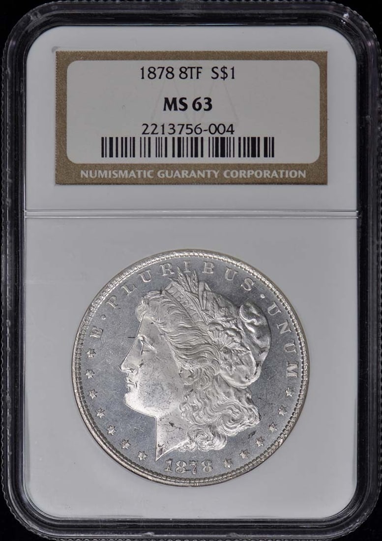 1878 8TF Morgan Dollar - $1 NGC MS63: 1878 8TF Morgan Dollar - $1 NGC MS63 A rare and highly sought-after 1878 Morgan Dollar, certified by the Numismatic Guaranty Corporation (NGC) as MS63, is up for auction. This uncirculated coin boasts