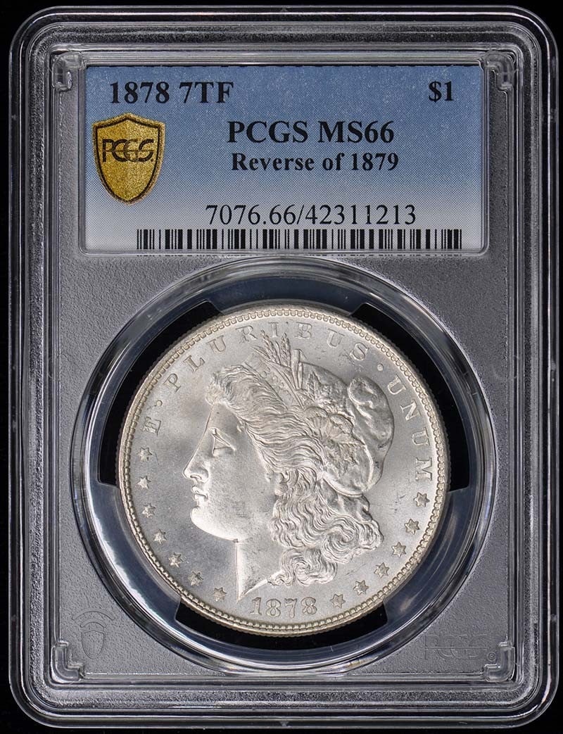 Reverse of 1879 Morgan Dollar PCGS MS66 - 1878 7TF $1 7TF: Reverse of 1879 Morgan Dollar PCGS MS66 - 1878 7TF $1 7TF Experience the rarity and beauty of an 1878 Morgan Dollar, certified MS66 by PCGS, in uncirculated condition. This stunning coin boasts a stri