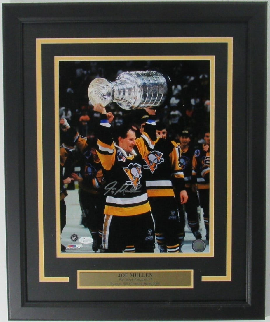 158162 Joe Mullen HOF Penguins Signed/ Autographed 11x14 Photo Framed JSA: 158162 Joe Mullen HOF Penguins Signed/ Autographed 11x14 Photo Framed JSA Get ready to relive the glory days of Pittsburgh Penguins hockey with this incredible 11x14 photo featuring the legendary Joe