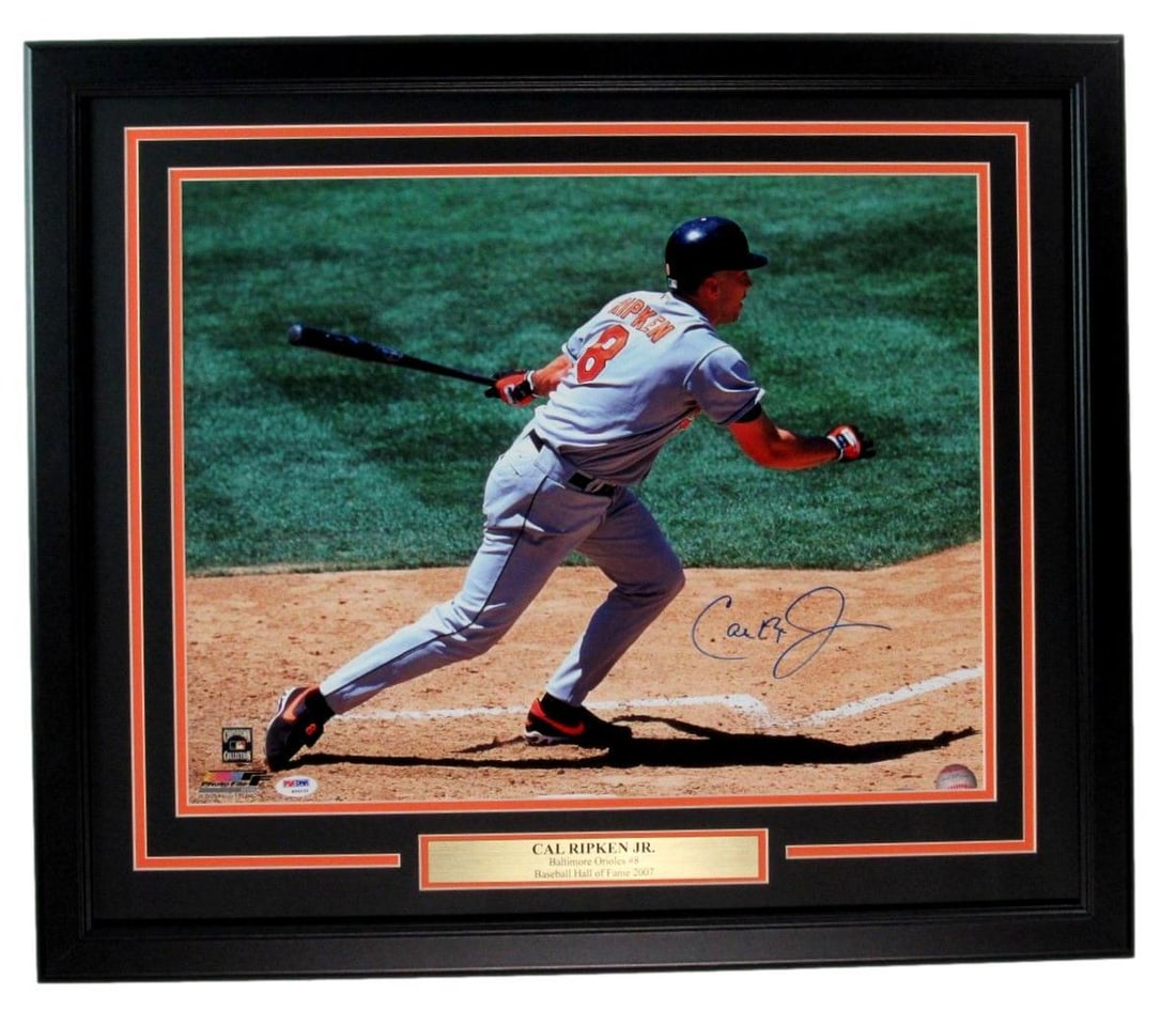 Cal Ripken Jr. HOF Autographed 16x20 Photo (PSA/ DNA 180108): Cal Ripken Jr. HOF Autographed 16x20 Photo (PSA/ DNA 180108) Own a piece of baseball history with this incredible 16x20 photo autographed by the legendary Cal Ripken Jr., a true icon in the sport. Thi