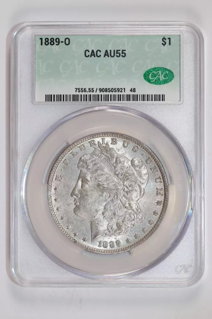 AU55 1889-O MORGAN DOLLAR CACG: AU55 1889-O MORGAN DOLLAR CACG Experience the rich history of the American West with this 1889-O Morgan Dollar, certified by the CAC (Coin Advisory Committee) and graded AU 55. Mintage from the New Or
