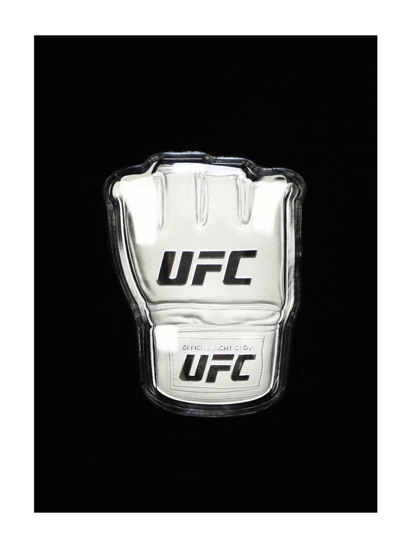 2024 UFC Glove 1 oz Silver Coin (Niue, Box & COA): 2024 UFC Glove 1 oz Silver Coin (Niue, Box & COA) Get ready to show off your UFC pride with the 2024 UFC Glove 1 oz Silver Coin, minted by Niue and presented in a premium box. This stunning coin is ad