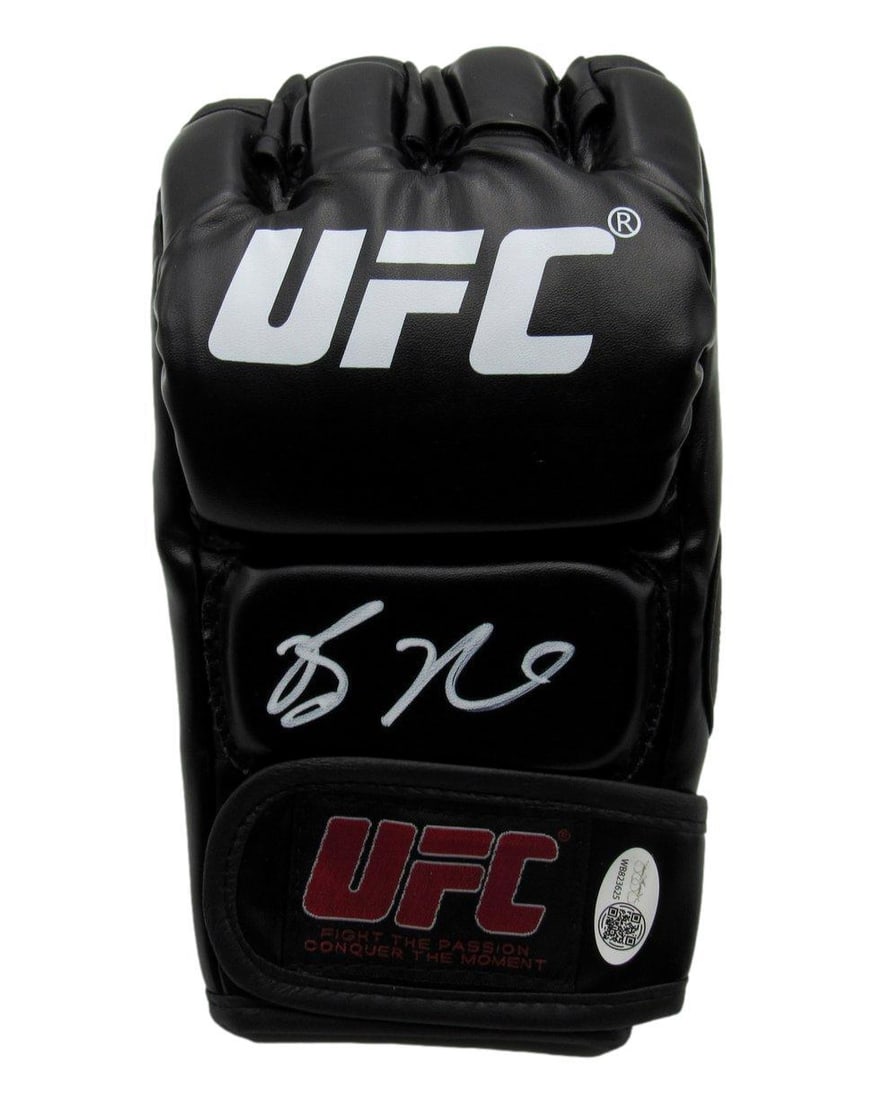 192686 Bo Nickal Autographed Left UFC Fight Glove JSA: 192686 Bo Nickal Autographed Left UFC Fight Glove JSA Get ready to rumble with the autographed left UFC fight glove of Bo Nickal, one of the most exciting young fighters in the sport! Authenticated by