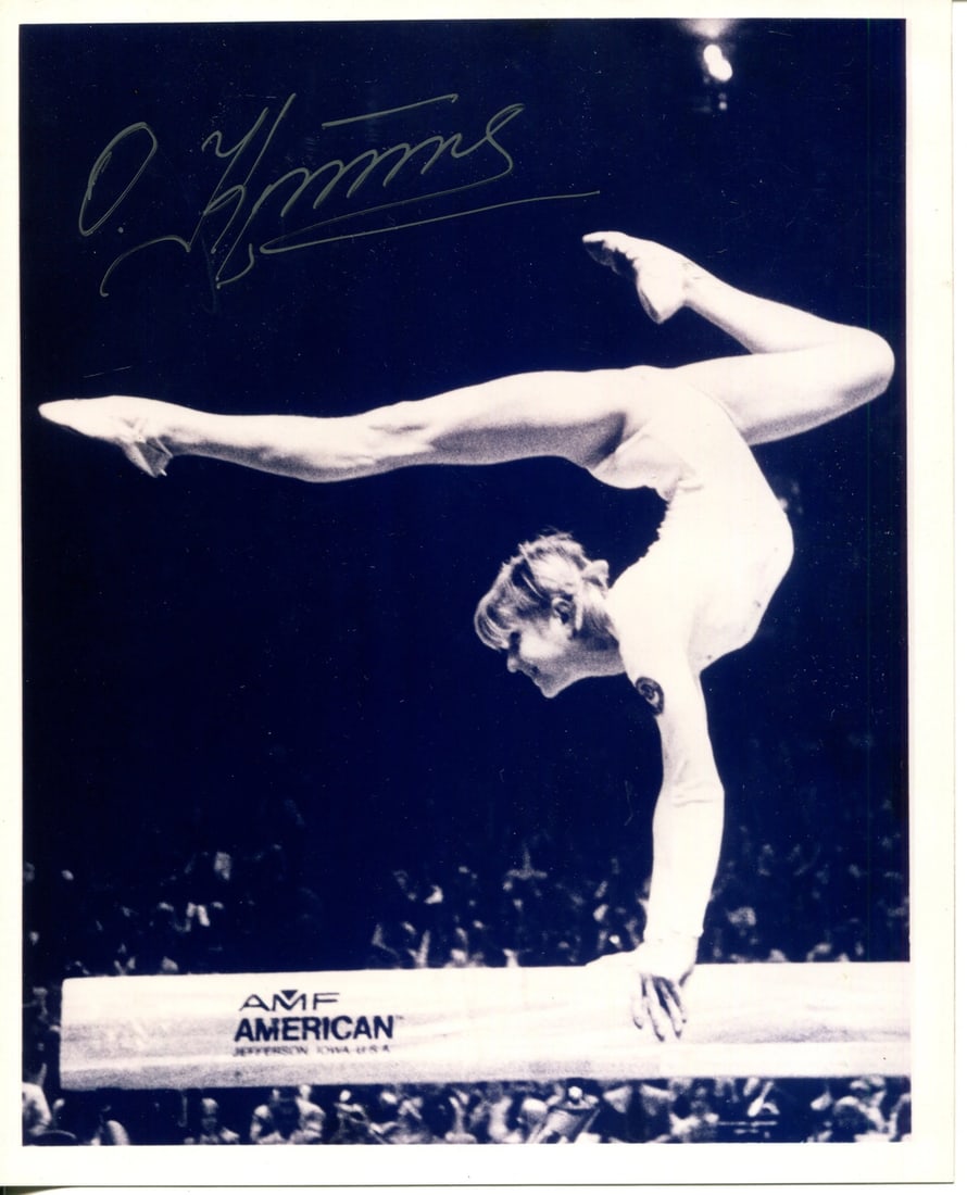 Photo Olga Korbut Autographed 8x10: Photo Olga Korbut Autographed 8x10 Get ready to own a piece of gymnastics history with this rare and unique autographed photo of Olga Korbut, the legendary Soviet gymnast who won 4 Olympic gold medals