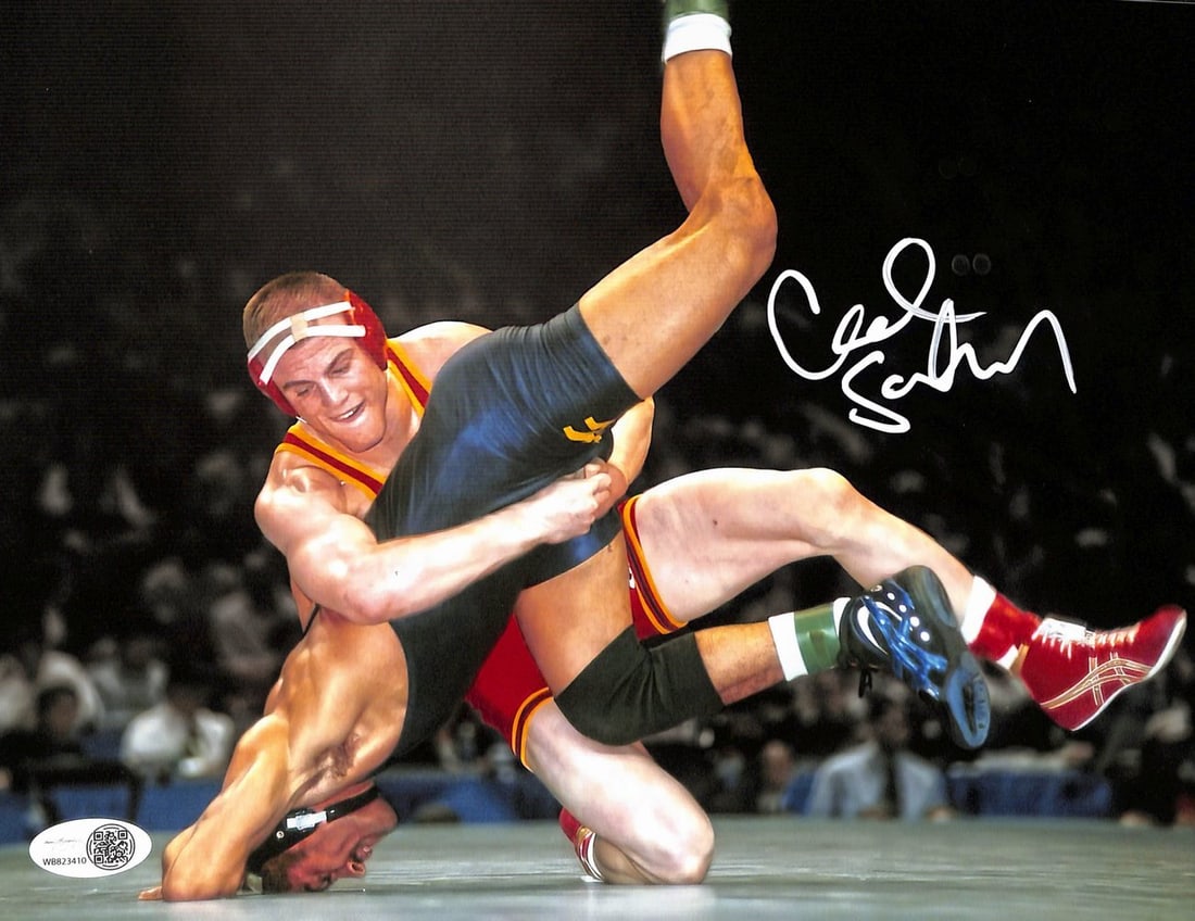 193169 Cael Sanderson Signed/ Autographed 8x10 Photo Penn State Wrestling JSA: 193169 Cael Sanderson Signed/ Autographed 8x10 Photo Penn State Wrestling JSA Meet the legendary Cael Sanderson, Penn State Wrestling's iconic coach and Olympic gold medalist! This rare 8x10 photo is