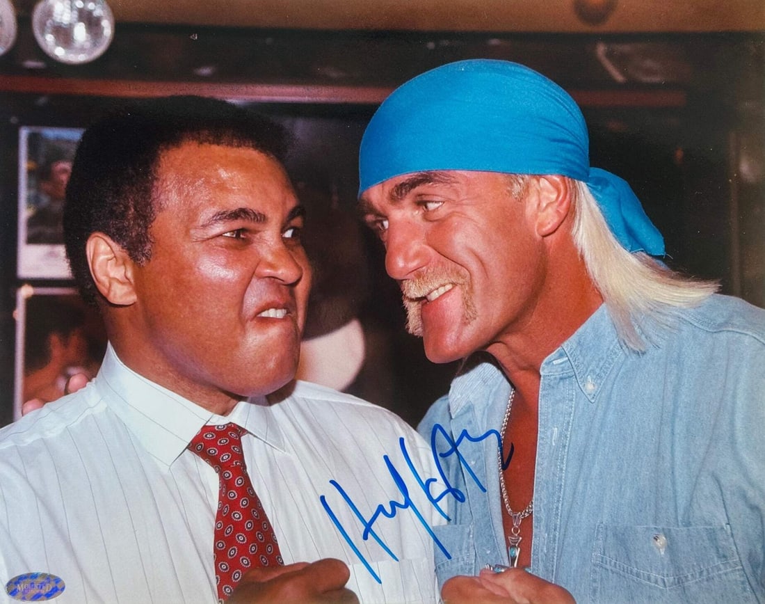 Hulk Hogan Autographed 8x10 Photo with Muhammad Ali: Hulk Hogan Autographed 8x10 Photo with Muhammad Ali Get ready to relive the greatest rivalries in sports history with this incredible autographed photo of Hulk Hogan and Muhammad Ali! Signed in blue s