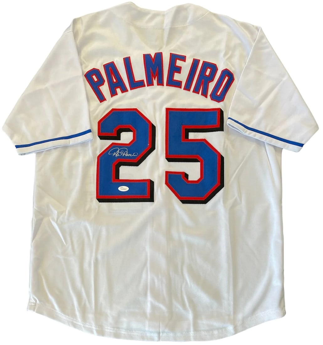 (JSA) Rafael Palmeiro Autographed Texas Rangers White Jersey: (JSA) Rafael Palmeiro Autographed Texas Rangers White Jersey Get ready to relive the glory days of Rafael Palmeiro's time with the Texas Rangers! This authentic, JSA-verified white jersey boasts an im