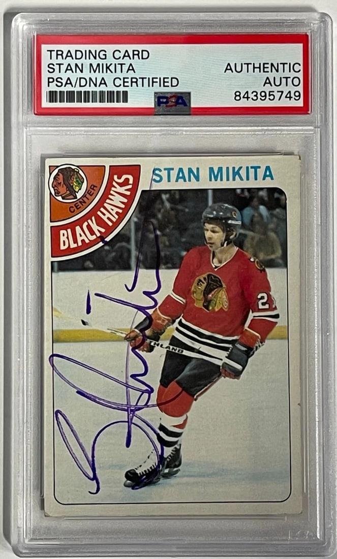 (PSA) Stan Mikita Autographed 1978-79 Topps Card #75: (PSA) Stan Mikita Autographed 1978-79 Topps Card #75 Get ready to relive the glory days of hockey with this authentic Stan Mikita autographed 1978-79 Topps card, certified by Professional Sports Authe