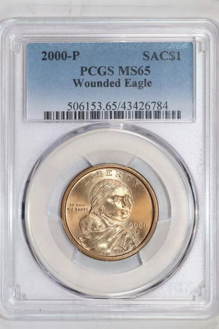 2000-P Wounded Eagle Sacagawea Dollar PCGS MS65: 2000-P Wounded Eagle Sacagawea Dollar PCGS MS65 Experience the majesty of American history with this stunning 2000-P Wounded Eagle Sacagawea Dollar, certified MS65 by PCGS. This uncirculated coin boas