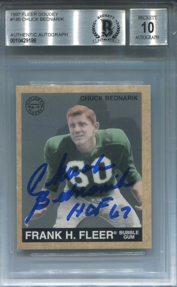 Bednarik '67 HOF Autographed 1997 Fleer Card: Bednarik '67 HOF Autographed 1997 Fleer Card Meet the iconic Chuck Bednarik, a legendary NFL player and Hall of Famer, who has left his mark on this 1997 Fleer card with a sharpie signature that reads