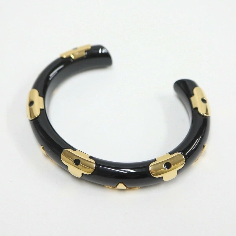 Louis Vuitton M63541 Monogram Bangle Bracelet in Gold & Black, Size M: Louis Vuitton M63541 Monogram Bangle Bracelet in Gold & Black, Size M Elevate your style with the iconic Louis Vuitton M63541 Monogram Bangle Bracelet, crafted in luxurious black gold and adorned with