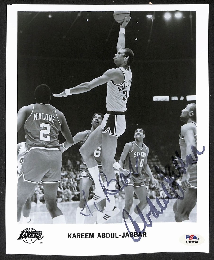 205935 Kareem Abdul-Jabbar HOF Signed/ Auto 8x10 Lakers Team Photo PSA/ DNA: 205935 Kareem Abdul-Jabbar HOF Signed/ Auto 8x10 Lakers Team Photo PSA/ DNA Meet the ultimate collectible for any basketball fan - a rare, autographed 8x10 team photo of the legendary Kareem Abdul-Jab