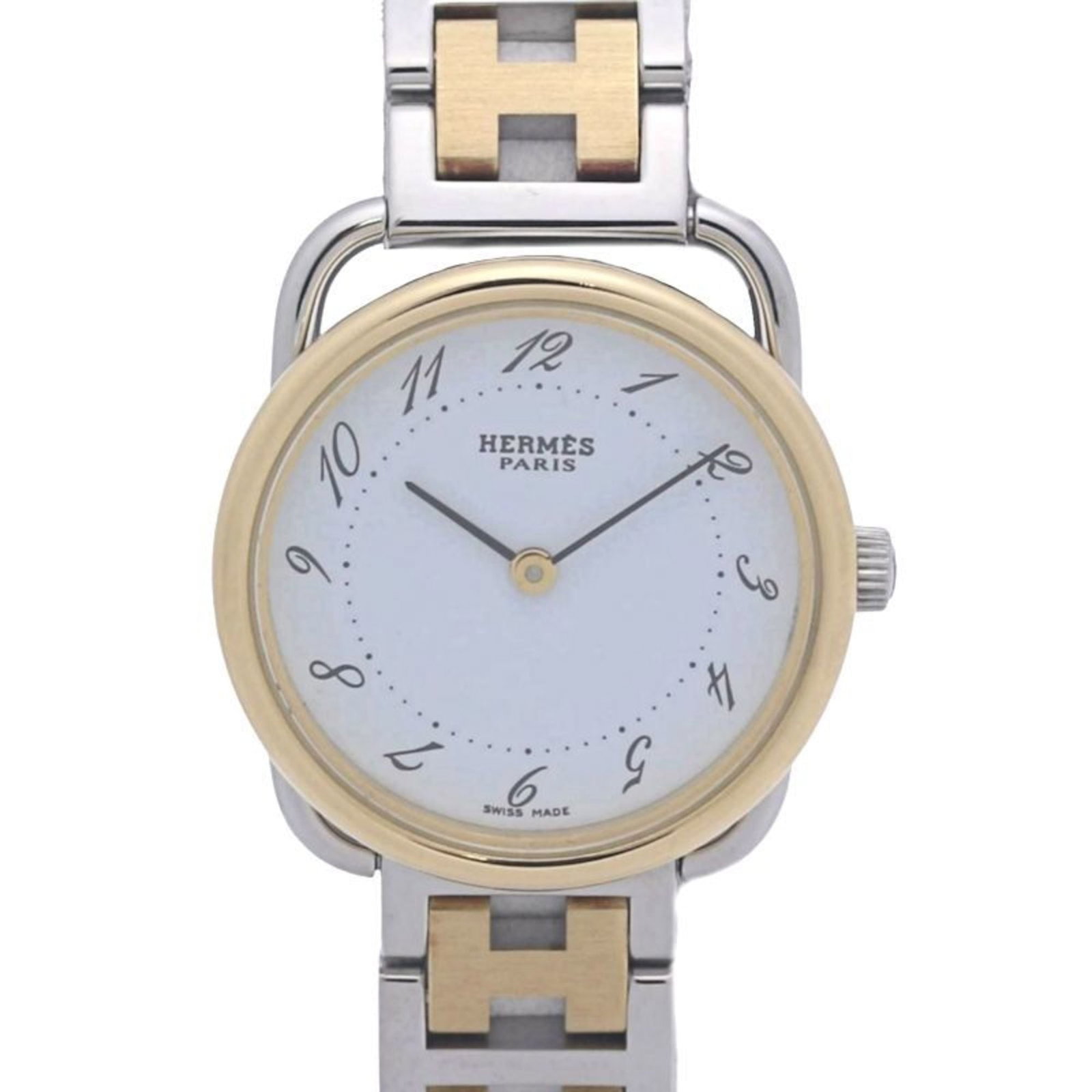 Wristwatch Hermes: Wristwatch Hermes A stunning gold plated Hermes wristwatch, boasting a sleek 25mm case and stainless steel band, is up for grabs. With its elegant white dial and refined details, this timeless piece i
