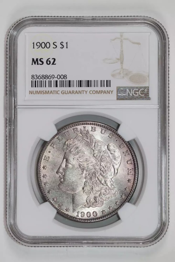 Morgan Dollar 1900-S NGC MS62: Morgan Dollar 1900-S NGC MS62 Experience the beauty of the 1900-S Morgan Dollar, certified MS62 by NGC, with its rich silver composition and stunning San Francisco mint mark. This highly sought-after