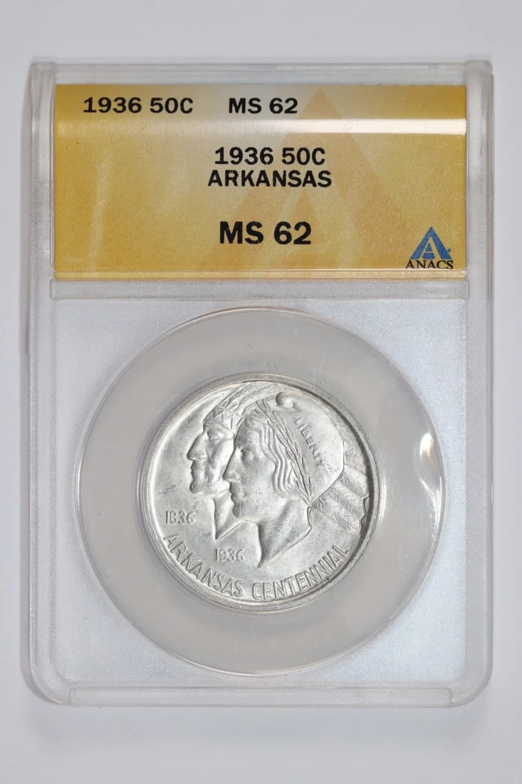 MS62 1936 ARKANSAS COMMEMORATIVE HALF DOLLAR ANACS: MS62 1936 ARKANSAS COMMEMORATIVE HALF DOLLAR ANACS A rare and highly sought-after collector's item, this 1936 Arkansas Commemorative Half Dollar is certified MS62 by the American Numismatic Society of