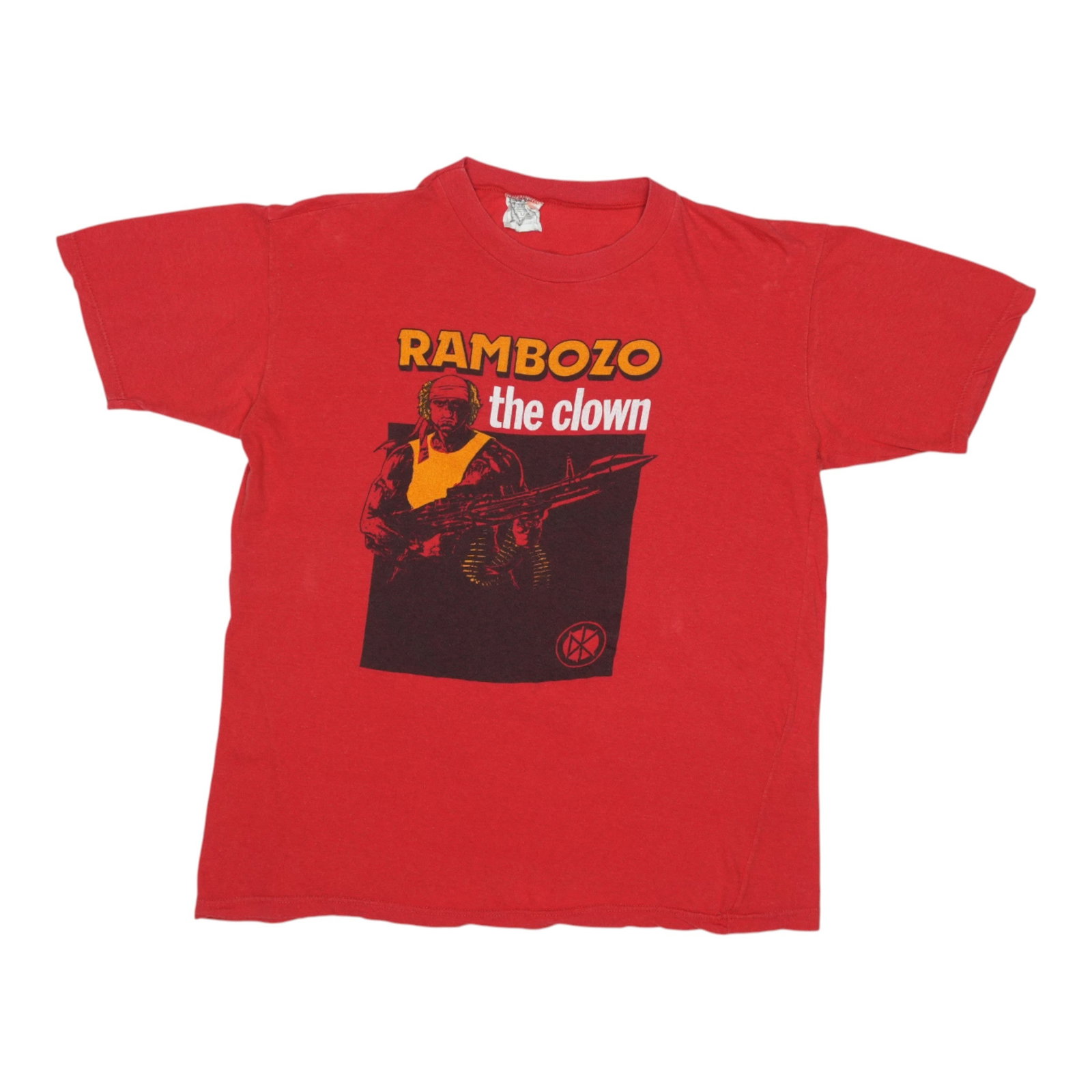 Shirt 1980s Dead Kennedys Rambozo The Clown: Shirt 1980s Dead Kennedys Rambozo The Clown Get ready to make a statement with the iconic 1980s Dead Kennedys Rambozo The Clown shirt! This vintage tee boasts bold red color and a classic design, meas