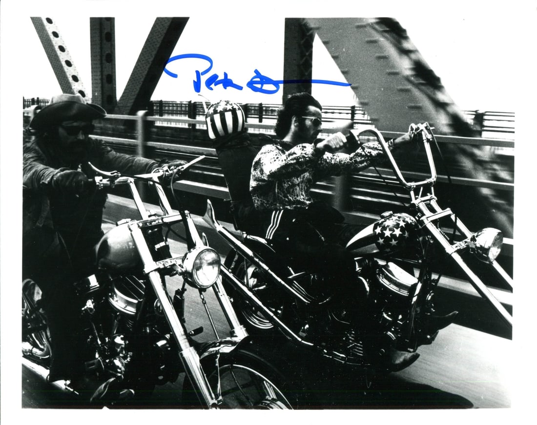 Photo Peter Fonda Autographed 8x10: Photo Peter Fonda Autographed 8x10 Meet the iconic Peter Fonda, captured in a rare and authentic 8x10 photo signed in blue sharpie across the front. This unique piece of memorabilia is authenticated b
