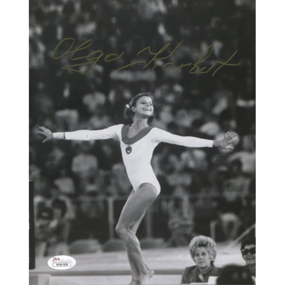 Photo Olga Korbut Autographed 8x10: Photo Olga Korbut Autographed 8x10 Meet the iconic Soviet gymnast Olga Korbut, captured in a stunning 8x10 photo signed in gold sharpie by the legendary athlete herself. Authenticated by James Spence
