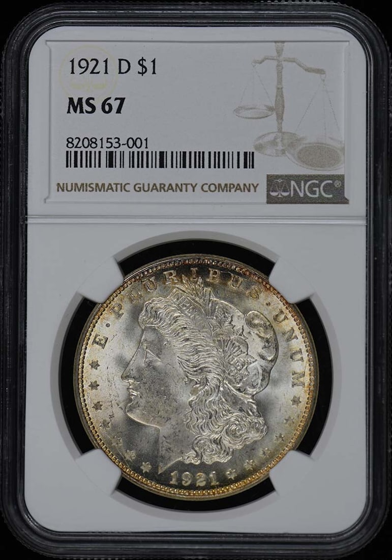 1921-D Morgan Dollar $1 MS67 NGC: 1921-D Morgan Dollar $1 MS67 NGC Experience the majesty of American numismatics with this stunning 1921-D Morgan Dollar, certified MS67 by NGC. With its pristine uncirculated condition and striking de