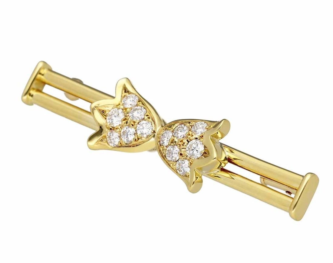 Vintage 18k Yellow Gold Dior Diamond Flower Bar Pin Brooch: Vintage 18k Yellow Gold Dior Diamond Flower Bar Pin Brooch Elevate your special occasions with this exquisite vintage 18k yellow gold Dior brooch, adorned with 12 sparkling diamonds in a delicate flow
