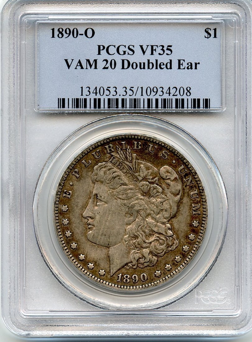 VF35 C8713- 1890-O VAM-20 DOUBLED EAR HIT LIST 40 MORGAN DOLLAR PCGS: VF35 C8713- 1890-O VAM-20 DOUBLED EAR HIT LIST 40 MORGAN DOLLAR PCGS A rare and highly sought-after 1890-O Morgan dollar, graded VF35 by PCGS, boasts an exceptional doubled ear hit on the obverse, a h