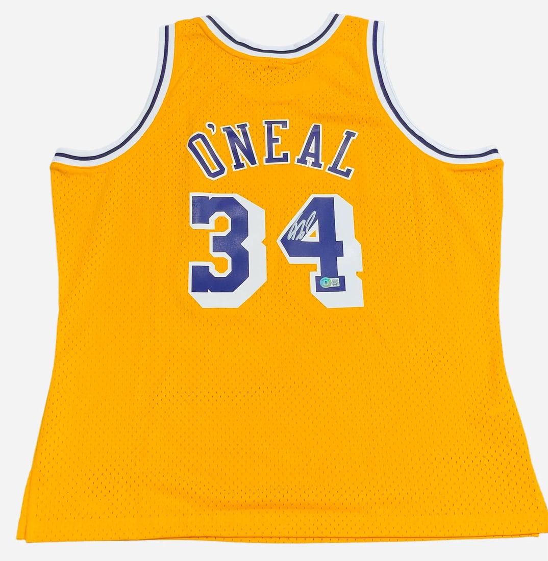 (Beckett) Shaquille O'Neal Autographed Los Angeles Lakers M&N Jersey: (Beckett) Shaquille O'Neal Autographed Los Angeles Lakers M&N Jersey Get ready to relive the dominance of Shaquille O'Neal with his authentic, Beckett-verified Los Angeles Lakers M&N jersey, signed in
