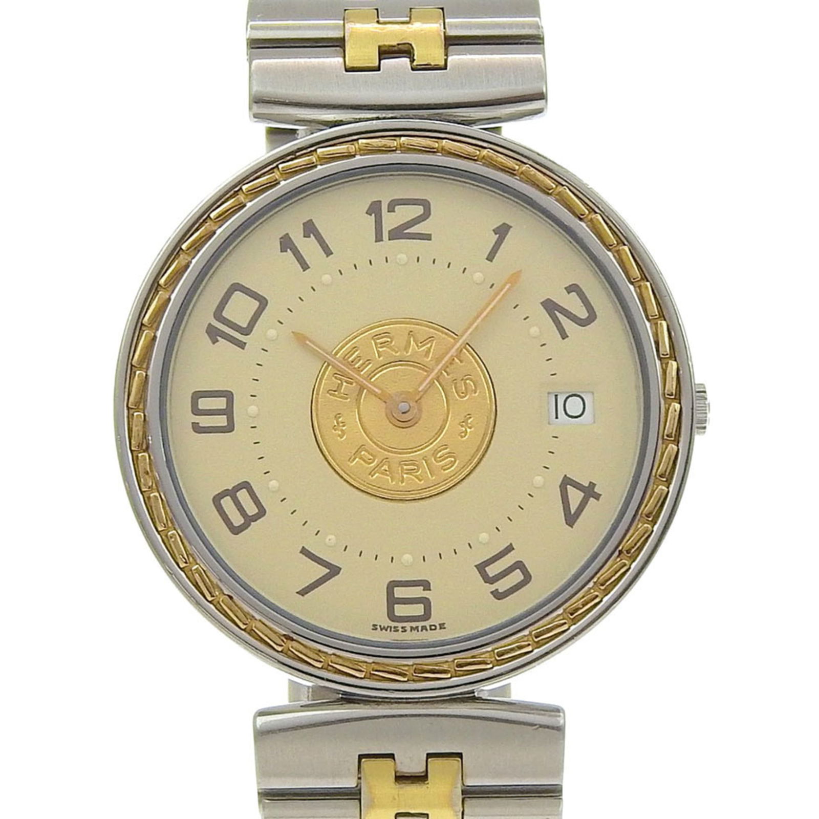 Wristwatch Hermes: Wristwatch Hermes A pre-owned Hermes wristwatch, boasting sleek stainless steel construction and an ivory dial, adds a touch of timeless elegance to any outfit. With its 32mm case diameter and adjusta